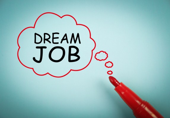 Dream Job concept is on blue paper with a red marker aside.